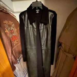 Black coat with leather on front and sweater material on back and arms.